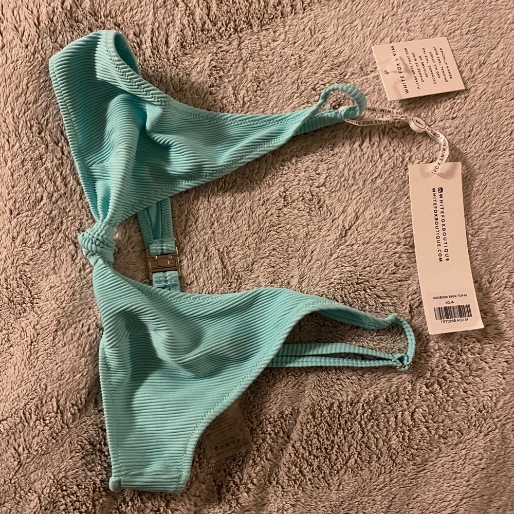 A medium white fox bikini. Never worn.